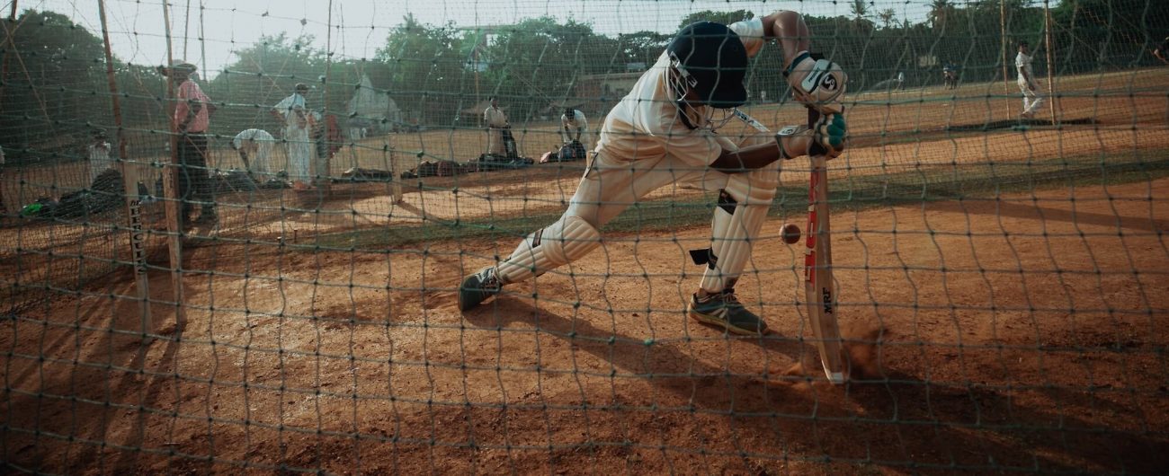 Man playing cricket