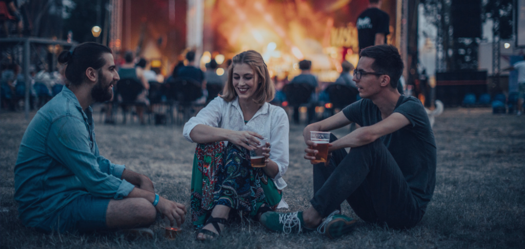 3 people at a festival 
